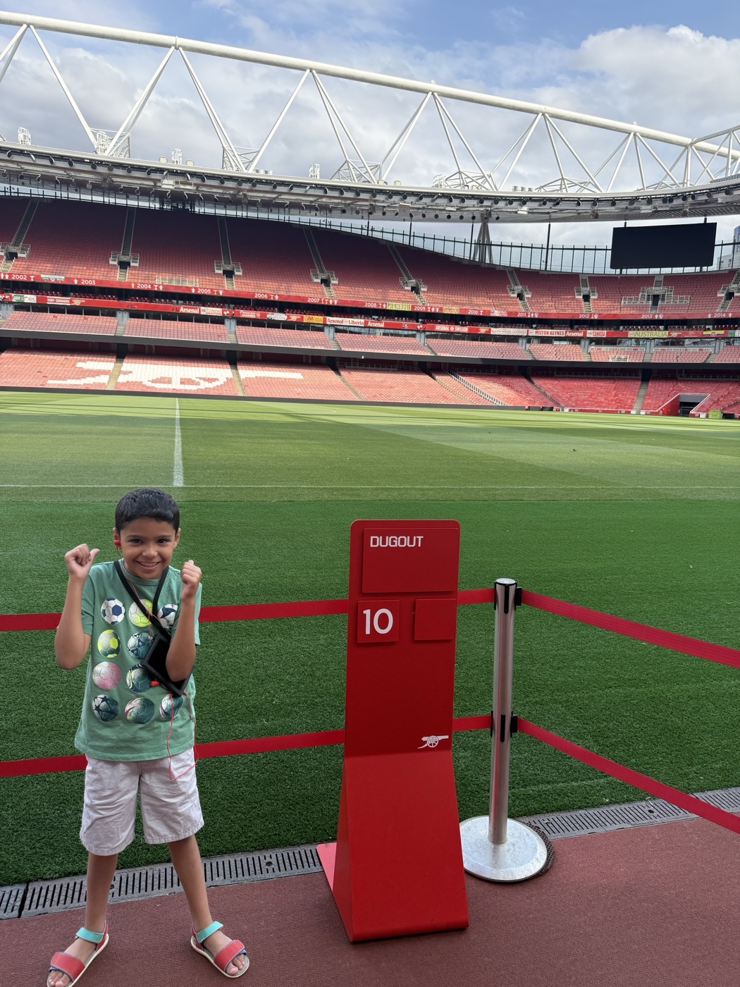 Zane flexing by the dugout at the stadium