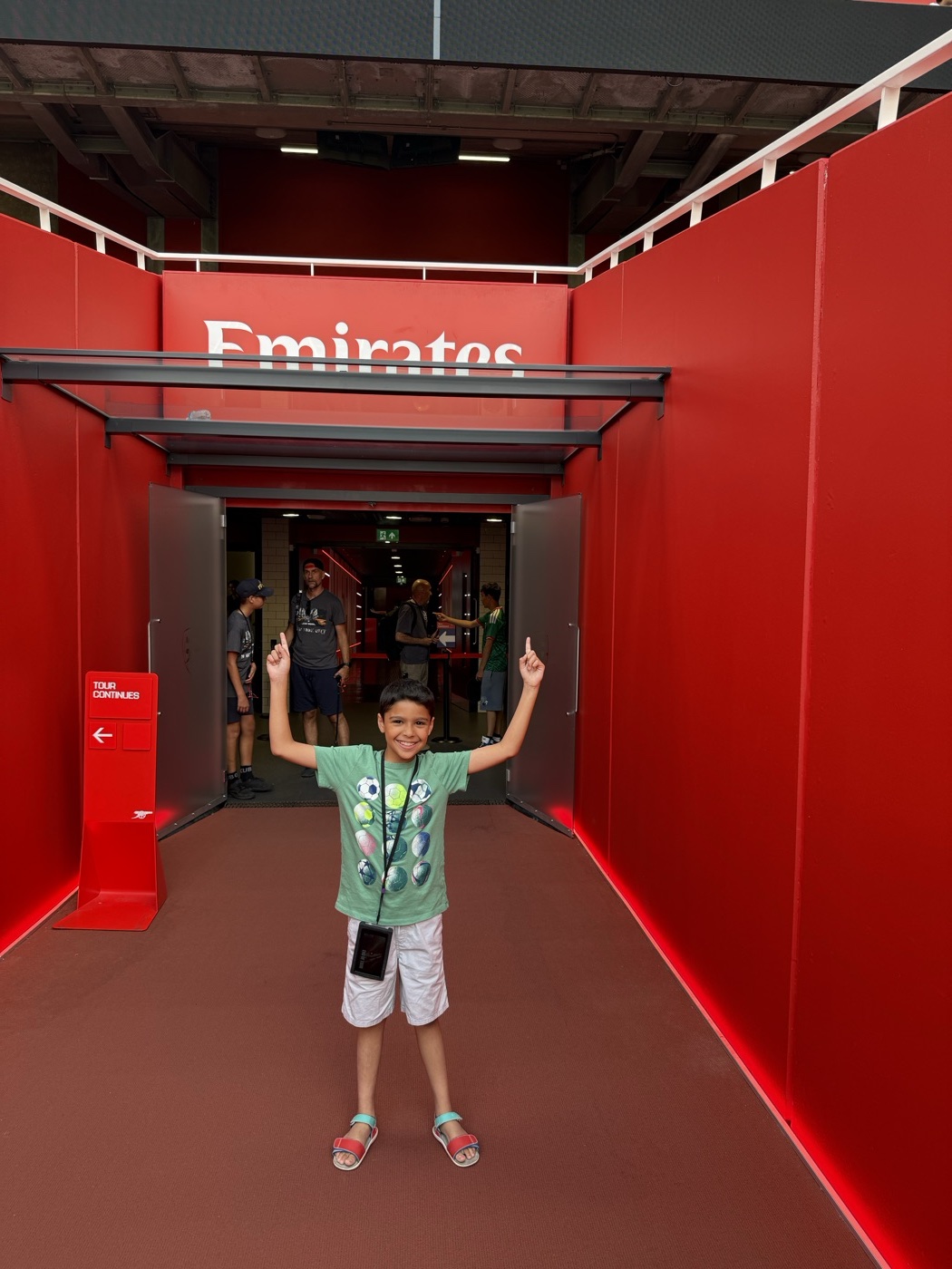 Zane with both arms up in the players' tunnel